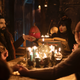 The roommates hold a séance.